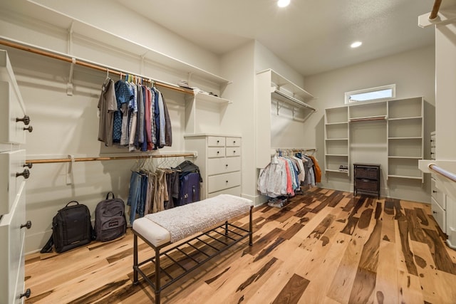 spacious closet featuring light hardwood / wood-style flooring