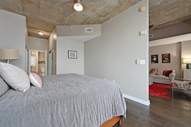 bedroom with ensuite bathroom, dark hardwood / wood-style floors, and ceiling fan