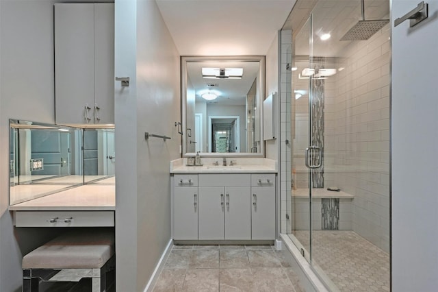 bathroom with vanity and a shower with shower door