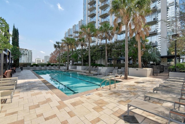 view of swimming pool featuring a patio area