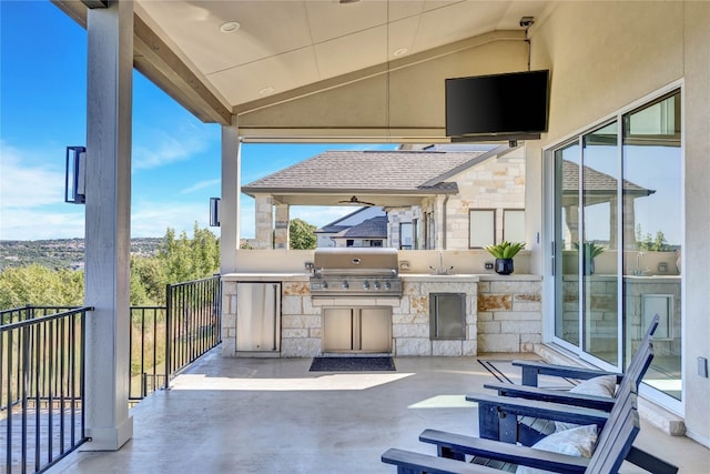 view of patio / terrace featuring grilling area and an outdoor kitchen