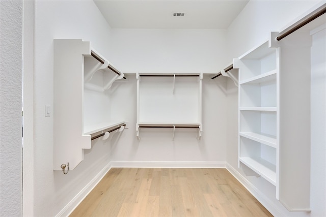 walk in closet featuring hardwood / wood-style flooring