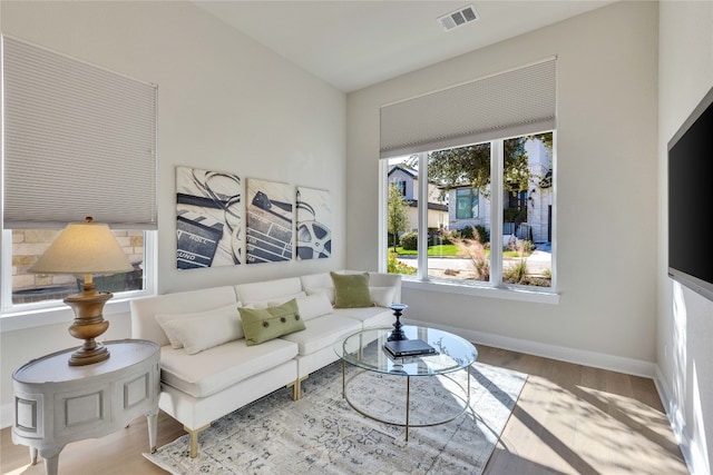 living room with light hardwood / wood-style floors