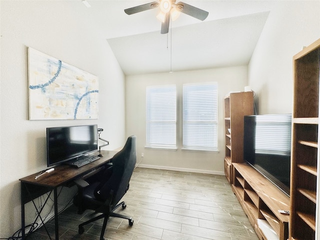 office space featuring hardwood / wood-style flooring, ceiling fan, and vaulted ceiling