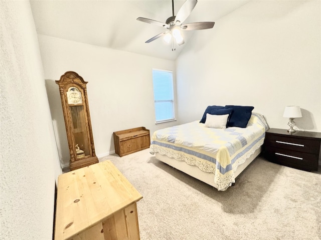 carpeted bedroom with vaulted ceiling and ceiling fan