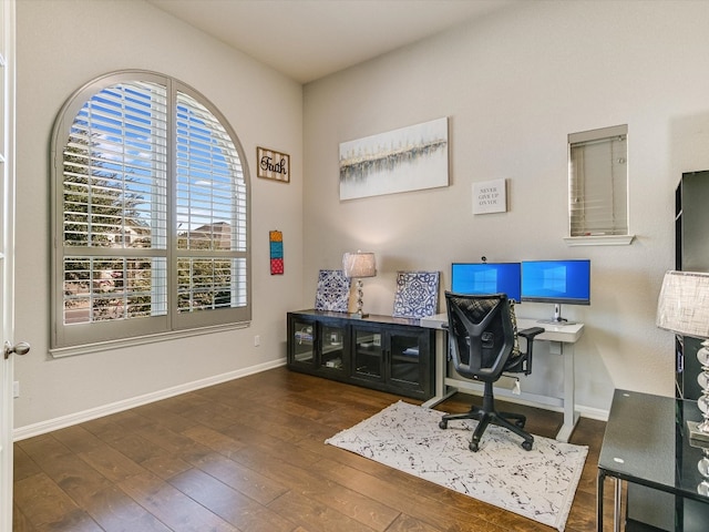 office with dark hardwood / wood-style flooring