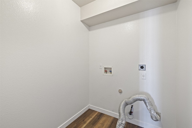 washroom with hookup for a gas dryer, dark hardwood / wood-style flooring, washer hookup, and electric dryer hookup