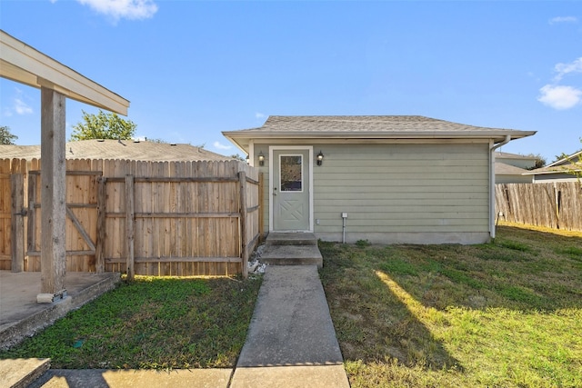 view of outbuilding featuring a yard