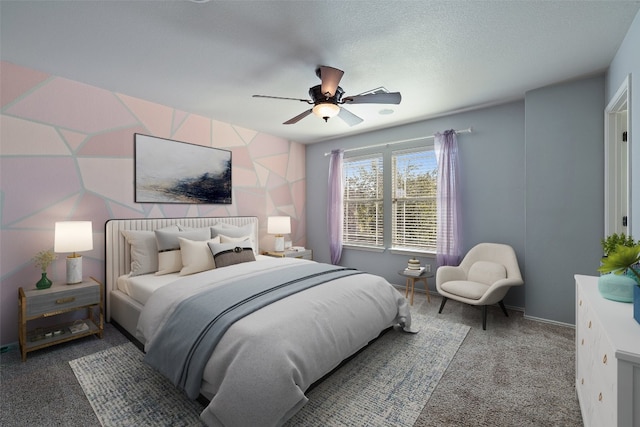 carpeted bedroom with a textured ceiling and ceiling fan