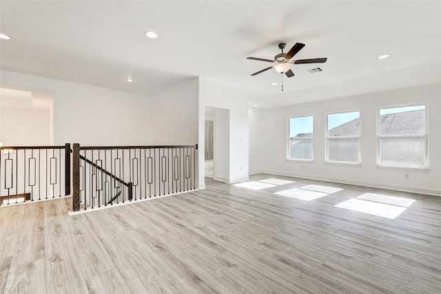 empty room featuring light hardwood / wood-style flooring and ceiling fan