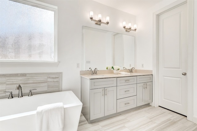 bathroom featuring vanity and a tub to relax in