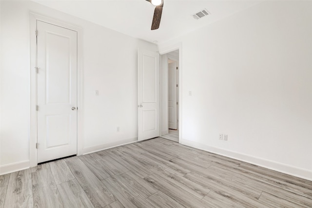 unfurnished bedroom with light wood-type flooring and ceiling fan