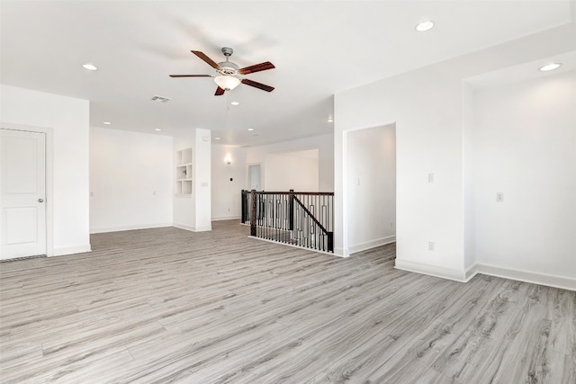 unfurnished room featuring light hardwood / wood-style flooring and ceiling fan