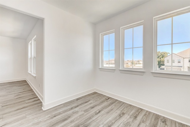 spare room featuring light hardwood / wood-style flooring