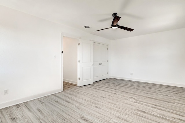 unfurnished room with ceiling fan and light hardwood / wood-style floors