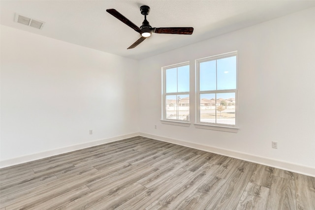 spare room with ceiling fan and light hardwood / wood-style flooring