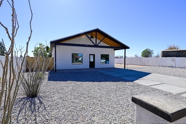 rear view of property featuring a patio