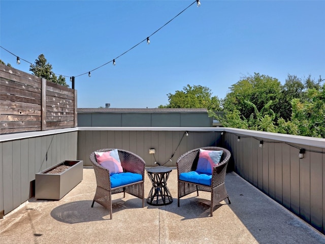 view of patio / terrace with a balcony