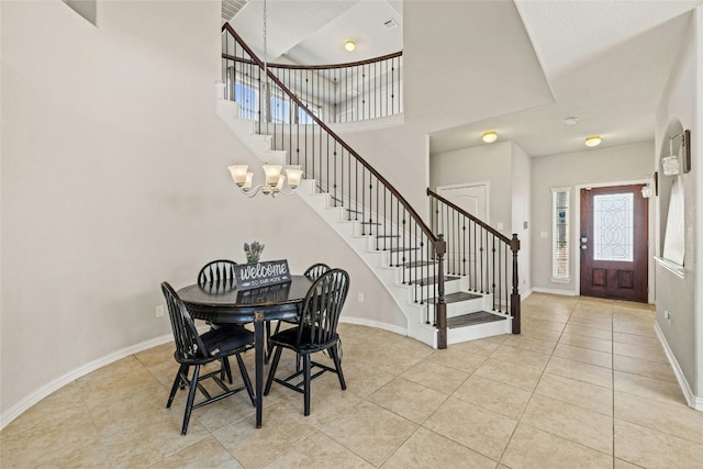 tiled dining room featuring a chandelier