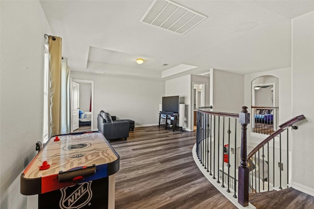 hall with dark hardwood / wood-style flooring