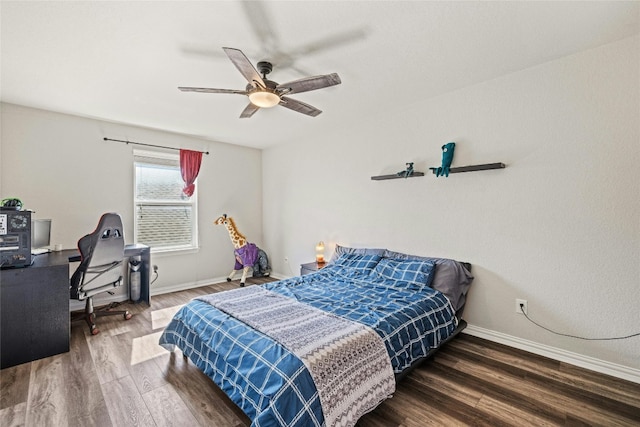 bedroom featuring ceiling fan and dark hardwood / wood-style flooring