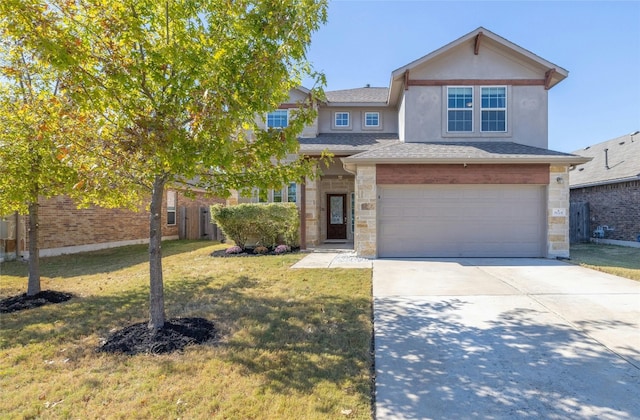 view of front facade with a front yard and a garage