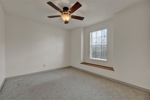 carpeted empty room with ceiling fan