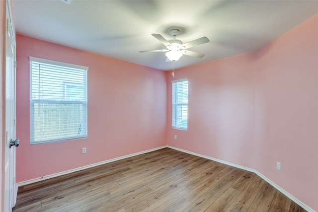 unfurnished room featuring ceiling fan and light hardwood / wood-style floors