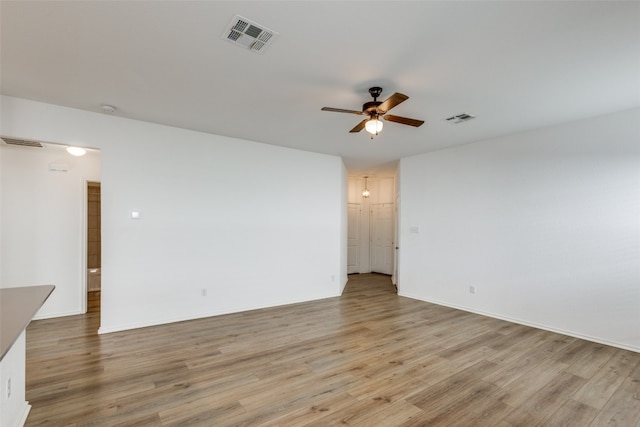 unfurnished room with ceiling fan and light hardwood / wood-style flooring