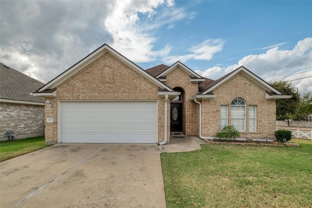 ranch-style home featuring an attached garage, brick siding, concrete driveway, and a front yard