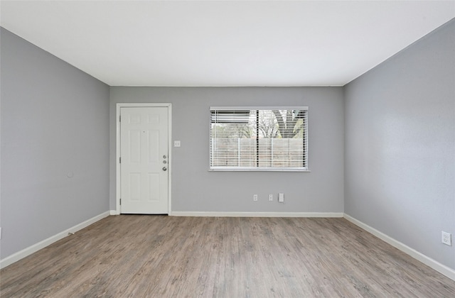 unfurnished room featuring light wood-type flooring