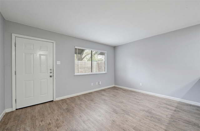 foyer entrance with light hardwood / wood-style flooring