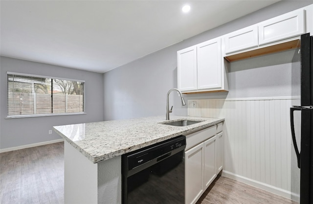 kitchen featuring black appliances, white cabinets, and kitchen peninsula