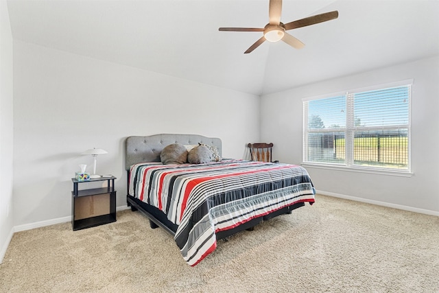 bedroom with ceiling fan, light carpet, and lofted ceiling