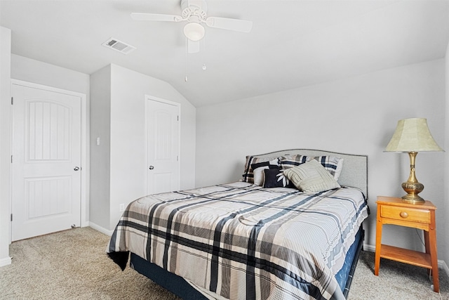 carpeted bedroom with ceiling fan and lofted ceiling