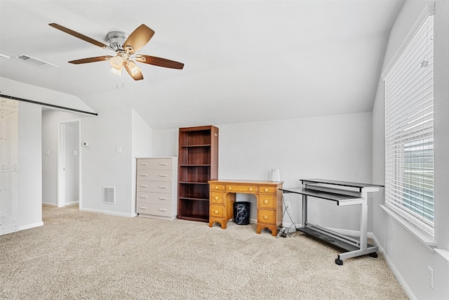 interior space with carpet flooring, ceiling fan, and vaulted ceiling