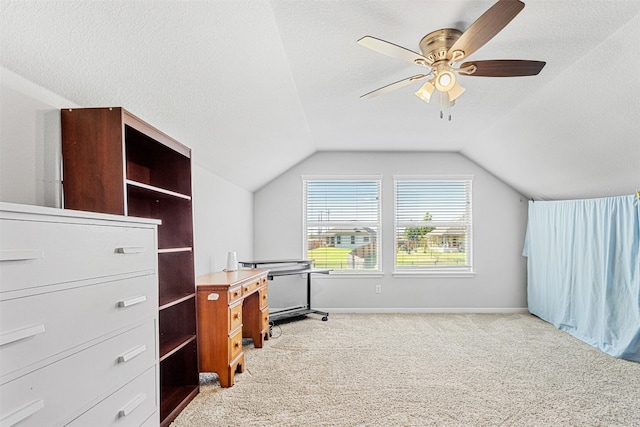 bonus room with a textured ceiling, light colored carpet, and lofted ceiling