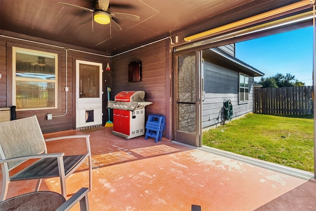 view of patio with area for grilling and ceiling fan