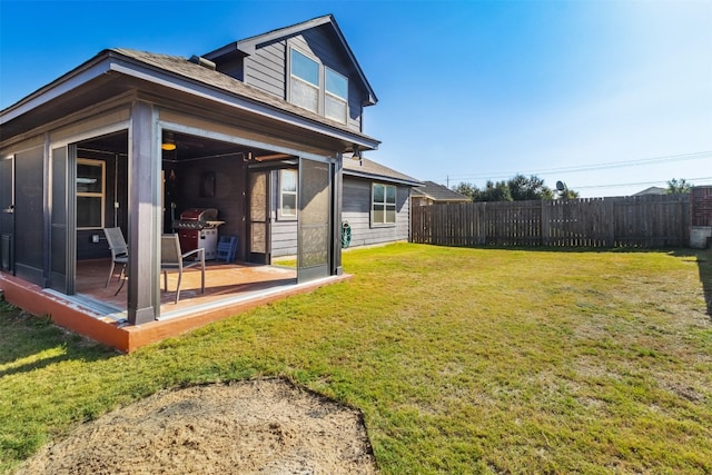 view of yard featuring a sunroom