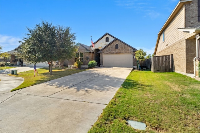 view of front of property with a front yard and a garage