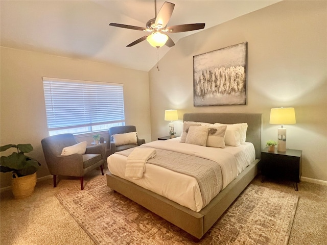 bedroom with ceiling fan, carpet floors, and lofted ceiling