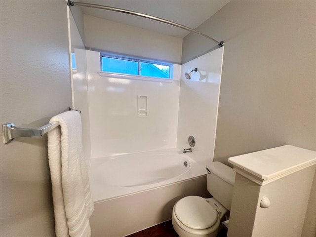 bathroom with toilet and shower / bathing tub combination