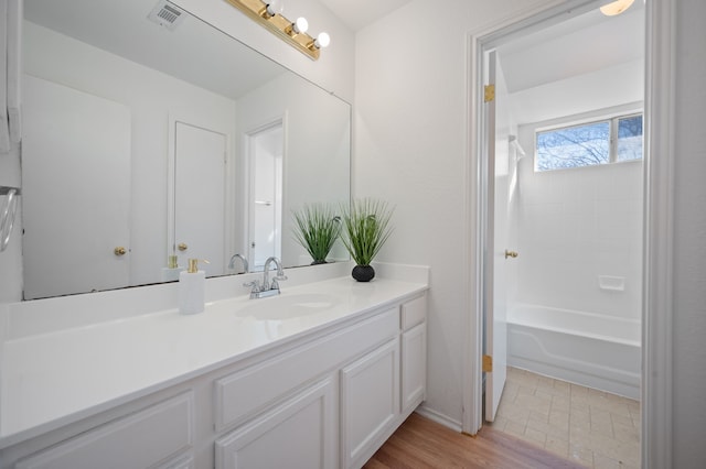 bathroom featuring vanity and shower / washtub combination