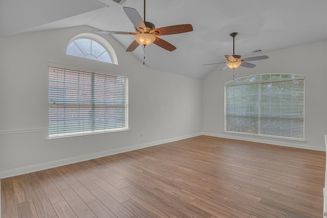 unfurnished room featuring light hardwood / wood-style flooring, ceiling fan, and lofted ceiling