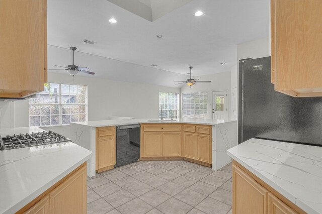 kitchen with black appliances, sink, ceiling fan, light brown cabinetry, and light tile patterned flooring