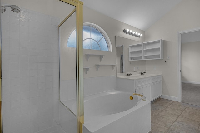 bathroom featuring tile patterned floors, vanity, shower with separate bathtub, and vaulted ceiling