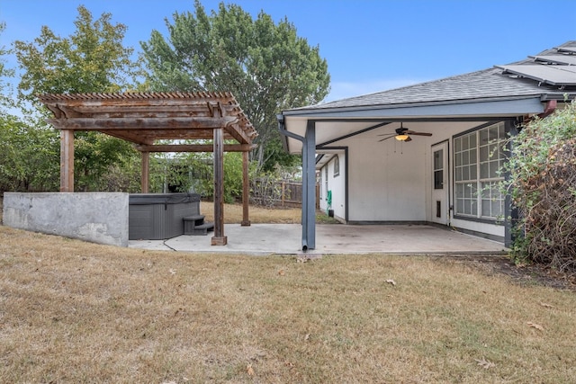 view of yard with ceiling fan, a pergola, a patio, and a hot tub