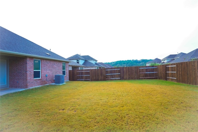 view of yard featuring central AC