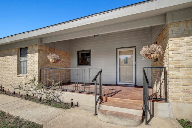 entrance to property featuring a porch