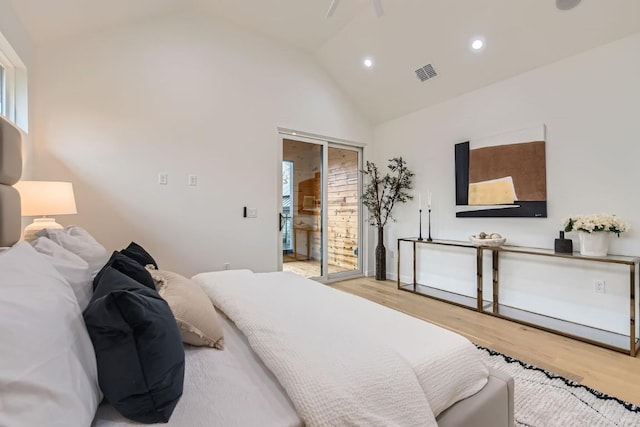 bedroom with high vaulted ceiling, access to exterior, and light wood-type flooring